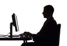 Silhouette Of Man Working Computer Royalty Free Stock Photos