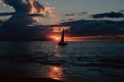 Silhouette of Sailboat on Body of Water during Sunset Stock Images Silhouette of Sailboat on Body of Water during Sunset Stock Images