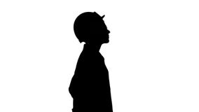 Silhouette Scientist physicist woman walking in lab coat and hardhat. stock footage Silhouette Scientist physicist woman walking in lab coat and hardhat. stock footage