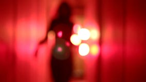 Just had my eyes dilated and I’m losing you all! Silhouette-sexy-woman-high-heels-dancing-coming-closer-blurry-red-corridor-medium-shot-65406056