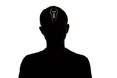 Silhouette of an unknown man who dawned on idea on a white isolated background, concept thought. Light bulb in head Stock Photos Silhouette of an unknown man who dawned on idea on a white isolated background, concept thought. Light bulb in head Stock Photos