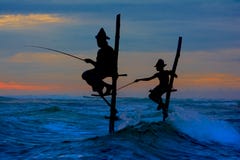 Silhouettes of the traditional Sri Lankan stilt fishermen royalty free stock image Silhouettes of the traditional Sri Lankan stilt fishermen royalty free stock image
