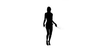Silueta de una mujer que usa una cuerda que salta metrajes Silueta de una mujer que usa una cuerda que salta metrajes