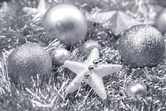 Silver Christmas Decorations on tinsel royalty free stock photo Silver Christmas Decorations on tinsel royalty free stock photo
