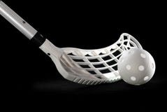 Silver floorball stick and white ball