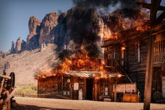Simulation of a city fire of an old wild western wooden building in a gold mine royalty free stock photos Simulation of a city fire of an old wild western wooden building in a gold mine royalty free stock photos