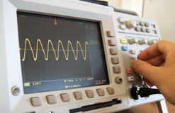 Sine wave on oscilloscope screen