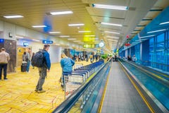 SINGAPORE, SINGAPORE - JANUARY 30, 2018: Unidentified people walking close to an escalators at Changi International stock photos SINGAPORE, SINGAPORE - JANUARY 30, 2018: Unidentified people walking close to an escalators at Changi International stock photos