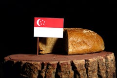 Singaporean flag on a stump with bread royalty free stock photo Singaporean flag on a stump with bread royalty free stock photo