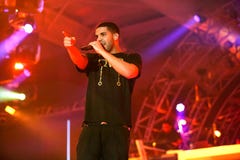 Singer Songwriter Drake live in concert on stage with backing band