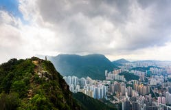 Sirva disfrutar de la opinión de Hong Kong de la persona chapada a la antigua de la roca del león fotografía de archivo libre de regalías Sirva disfrutar de la opinión de Hong Kong de la persona chapada a la antigua de la roca del león fotografía de archivo libre de regalías