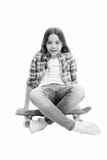 Sit and relax. Kid girl relaxed sits penny board. Learning how to ride penny board. Modern teen hobby. Girl happy face stock image Sit and relax. Kid girl relaxed sits penny board. Learning how to ride penny board. Modern teen hobby. Girl happy face stock image