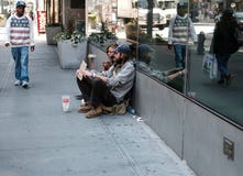 Homeless couple looking for charity on the streets of New York city. stock photography Homeless couple looking for charity on the streets of New York city. stock photography