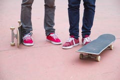 Skateboarders, skaters with skateboards in skatepark royalty free stock photography Skateboarders, skaters with skateboards in skatepark royalty free stock photography