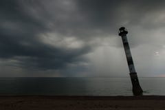 Skew lighthouse in the Baltic Sea. Stormy night on the beach. Kiipsaar, Harilaid, Saaremaa, Estonia, Europe. stock photography Skew lighthouse in the Baltic Sea. Stormy night on the beach. Kiipsaar, Harilaid, Saaremaa, Estonia, Europe. stock photography