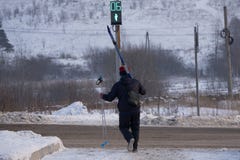 Skier walks down the slope with skis in his hands in the snow . stock image Skier walks down the slope with skis in his hands in the snow . stock image