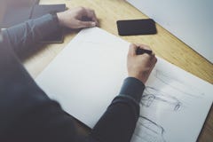 Skilled designer caucasian man drawing abstract sketch with pen.Art work process.Creative hobby.Noting ideas in copy stock images Skilled designer caucasian man drawing abstract sketch with pen.Art work process.Creative hobby.Noting ideas in copy stock images