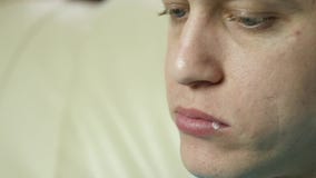 Skinny man eats fast food snack with great enjoyment. guy chewing junk food with big appetite. slow motion stock video footage Skinny man eats fast food snack with great enjoyment. guy chewing junk food with big appetite. slow motion stock video footage