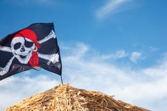 A skull and crossbones pirate flag waving in the wind., Jolly Roger, Pirates flag stock photos A skull and crossbones pirate flag waving in the wind., Jolly Roger, Pirates flag stock photos