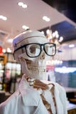 Skull head wearing eyeglasses and white scientific lab coat stock images Skull head wearing eyeglasses and white scientific lab coat stock images