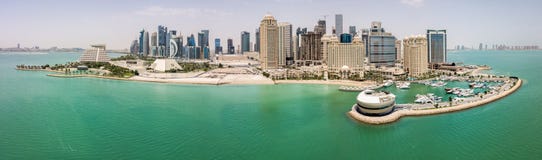 The skyline of Doha, Qatar, Persian Gulf, Middle East. Modern rich middle eastern city of skyscrapers, aerial view. stock photo The skyline of Doha, Qatar, Persian Gulf, Middle East. Modern rich middle eastern city of skyscrapers, aerial view. stock photo
