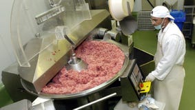 Slaughterhouse workers in the refrigerator Stock Photo Slaughterhouse workers in the refrigerator Stock Photo