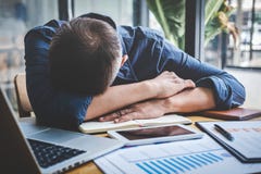 Sleeping Businessman, Tired senior businessman sleeping having long working day overworked on table in his office stock photo Sleeping Businessman, Tired senior businessman sleeping having long working day overworked on table in his office stock photo