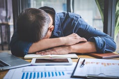 Sleeping Businessman, Tired senior businessman sleeping having long working day overworked on table in his office royalty free stock photos Sleeping Businessman, Tired senior businessman sleeping having long working day overworked on table in his office royalty free stock photos