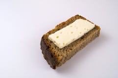 Slice of brynza on black bread stock photo Slice of brynza on black bread stock photo