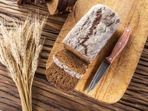Sliced black bread on a wooden plank. royalty free stock image Sliced black bread on a wooden plank. royalty free stock image