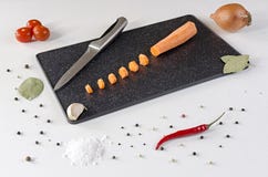 Sliced into small pieces carrot on a dark cutting board stock image Sliced into small pieces carrot on a dark cutting board stock image