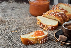 Sliced Sweet Braided Bread, Coffee And Jam. Concept Holliday Breakfast. Closeup, Shallow Depth Of Field Royalty Free Stock Images Sliced Sweet Braided Bread, Coffee And Jam. Concept Holliday Breakfast. Closeup, Shallow Depth Of Field Royalty Free Stock Images
