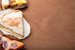 Slices of a homemade pie on a brown background, empty space for text royalty free stock image Slices of a homemade pie on a brown background, empty space for text royalty free stock image