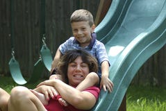 Slide. Photo of Mother and Child on Slide Slide. Photo of Mother and Child on Slide