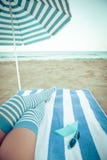 Slim woman legs on a beach Stock Photo Slim woman legs on a beach Stock Photo
