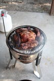 Slow cooking country style ribs and chicken on a gas powered smoker on patio stock photography Slow cooking country style ribs and chicken on a gas powered smoker on patio stock photography