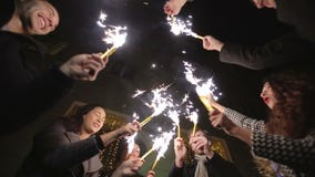SLOW MOTION: Friends with sparklers dancing