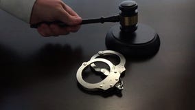 Slow Motion Judge Slamming Gavel Down Next To Handcuffs