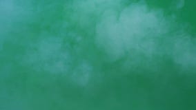 Slow motion of real white smoke, fog, steam on green screen, abstract background