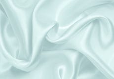 Släta elegant blå lyxig torkduketextur för silke eller för satäng som abstra arkivbilder Släta elegant blå lyxig torkduketextur för silke eller för satäng som abstra arkivbilder
