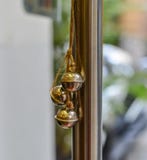 Small bells hanging on glass door royalty free stock photos Small bells hanging on glass door royalty free stock photos