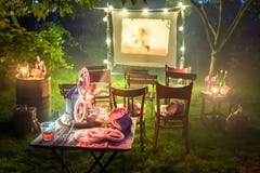 Small cinema with old analog films in summer evening stock images Small cinema with old analog films in summer evening stock images