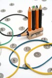 Small Color Pencils On A Unusual Sharpener And Elastic Band Stock Images Small Color Pencils On A Unusual Sharpener And Elastic Band Stock Images