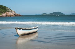 Small Fishing Boat on Beach in Southern Brazil stock photos Small Fishing Boat on Beach in Southern Brazil stock photos