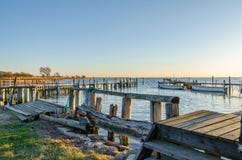 Small harbor with fishing boats in the sunset Stock Photo Small harbor with fishing boats in the sunset Stock Photo