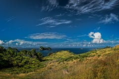 Small island in the ocean, cloudy blue sky, Coromandel Peninsula, New Zealand stock photography Small island in the ocean, cloudy blue sky, Coromandel Peninsula, New Zealand stock photography