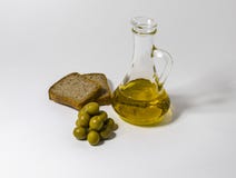 A small jug with oil and some olives, fresh bread. stock photos A small jug with oil and some olives, fresh bread. stock photos