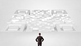 Small man standing in front of a huge maze royalty free stock photo Small man standing in front of a huge maze royalty free stock photo