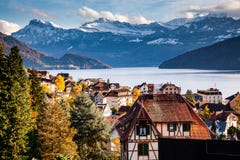 Small Mountain Village And Snowy Peaks Of Alps In The Background Royalty Free Stock Photos Small Mountain Village And Snowy Peaks Of Alps In The Background Royalty Free Stock Photos