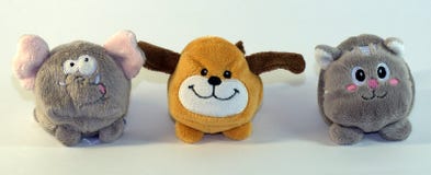 Small soft children`s toys depicting elephant cubs, dogs and cats. The picture was taken in close-up. stock photo Small soft children`s toys depicting elephant cubs, dogs and cats. The picture was taken in close-up. stock photo